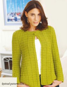 a woman wearing a green knitted jacket