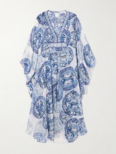 Camilla's kaftan is decorated with blue and white crystals for subtle sparkle. Patterned with ornate florals and leopard motifs, it's cut from silk-chiffon with sweeping batwing sleeves and ties at the back to define the floaty shape. Wear yours with a tonal bikini and a wide-brimmed hat. Summer Embellished Georgette Kaftan, Bohemian Georgette Kaftan With Floral Print, Bohemian Embellished Silk Kaftan, Bohemian Embellished Georgette Dresses, Bohemian Georgette Beach Dress, Elegant Floral Print Flowy Kaftan, Elegant Blue Floral Print Kaftan, Elegant White Printed Kaftan, Elegant Flowy Printed Kaftan