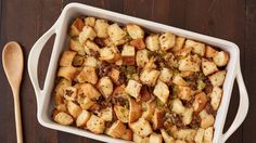 a casserole dish with bread and stuffing in it