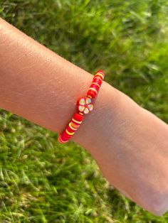 Trendy red and yellow flower bracelet Red Summer Bracelet Jewelry, Red Beaded Flower Shaped Jewelry, Red Flower Charm Jewelry For Spring, Red Spring Jewelry With Flower Charm, Spring Red Jewelry With Flower Charm, Red Jewelry With Flower Charm For Spring, Red Bracelet Jewelry For Summer, Handmade Red Bracelets For Spring, Red Flower-shaped Jewelry For Spring