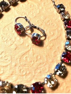 Swarovski Crystal Necklace and Earrings!  Ruby red, champagne silk and black diamond. Cup chain neck Formal Red Sparkling Jewelry, Red Sparkling Crystal Jewelry, Cup Chain Bracelet, Red Champagne, Swarovski Crystal Necklace, Necklace Box, Swarovski Crystal Earrings, A Necklace, Purple Velvet