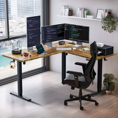 a computer desk with two monitors and a keyboard on it in front of a window