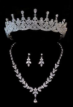 a tiara and earrings are shown on a black background