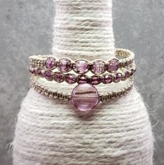 "LOVE THIS ONE!! **  Wear one bracelet at a time or wear all three at once! Or pair them with your existing bracelets!  ** ::ITEM:: 3 Removable Beaded Macrame Hemp Bracelets Made w/ Premium Czech Glass Beads ::COLOR:: Transparent Blush Pink, Transparent Pink/Purple Bronze Luster, & Transparent Crystal/Pink/Purple Swirl w/ Bronze Finish Lentil, Cathedral, & Fire Polished Beads on Light Brown Hemp ::LENGTH::  7 1/8\" ---> To determine what bracelet length you need, find a piece of string or flexible measuring tape. Then, wrap the string or measuring tape around your wrist just above your wrist bone. Once you have that measurement, add 1/4\" to 3/4\" to your measurement (depending on how fitted you want it). If you would like any help figuring out what length you need, please feel free to mes Cheap Bohemian Style Pink Braided Bracelet, Beaded Macrame, Hemp Bracelet, Hemp Bracelets, Purple Swirl, Minimalist Women, Macrame Bracelets, Measuring Tape, Braided Bracelets