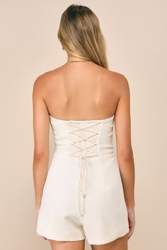 Show off your chicest side with your favorite blazer, flirty heels, and the Lulus Cute Expression Cream Jacquard Strapless Bustier Romper! Lightweight woven jacquard, with a raised weave-like pattern throughout, shapes this modish romper that boasts a strapless, bustier-inspired bodice with seamed cups, supportive boning, and a sweetheart neckline (with hidden no-slip strips). The fitted waist tops flirty shorts that feature seam detailing and a figure-flaunting fit. A trendy lace-up design and Lace Tube Top For Spring, Spring Lace Tube Top, Chic Fitted Bodice Tube Top For Date Night, Chic Lace Summer Tube Top, Chic Lace Tube Top For Summer, Summer Strapless Lace Corset, Fitted White Lace Tube Top, Strapless Lace Corset For Summer, Spring Tube Top With Corset Back And Sweetheart Neckline