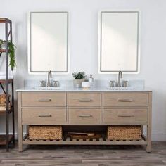 two mirrors are above the double sinks in this bathroom