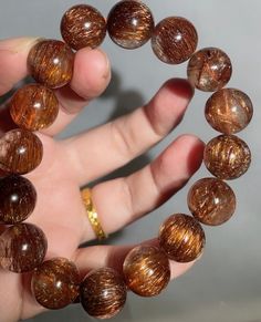 Material:Copper Rutilated Quartz  Gemstone size : Approx 13mm   quantity: one strand  6mm -apporx 62pcs beads 8mm -apporx 47pcs beads 10mm -apporx 37pcs beads 12mm -apporx 32pcs beads 14mm -apporx 28pcs beads 16mm -apporx 22pcs beads 18mm -apporx 20pcs beads 20mm -apporx 18pcs beads Energy Bracelets, Copper Red, Healing Energy, Quartz Bracelet, Rutilated Quartz, Bracelet Jewelry, Energy Healing, Jewelry Gifts, Jewelry Bracelets