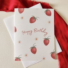 two cards with strawberries on them and the words happy birthday written in red ink