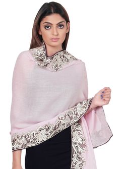 This luxurious baby pink cashmere scarf features a stunning inner border of a floral-bird embroidery in a contrasting beige color. Elevate your style by wrapping yourself with elegance, style, and warmth in this captivating scarf finished with a tiny contrasting black-colored lace edging. A perfect accessory for all occasions. Elegant Shawl With Embroidered Border, Elegant Silk Embroidered Shawl Fabric, Elegant Silk Embroidered Shawl, Elegant Embroidered Scarves For Festive Occasions, Elegant Resham Embroidery Shawl For Eid, Elegant Resham Embroidered Shawl For Eid, Elegant Pashmina Shawl With Embroidered Border, Elegant Shawl With Embroidered Border In Traditional Drape, Elegant Unstitched Embroidered Shawl Fabric