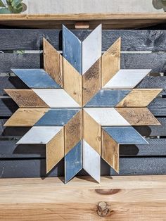 a wooden snowflake sitting on top of a table