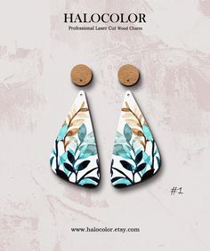 the earrings are made from wood and painted with floral designs