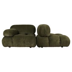 two green couches sitting next to each other