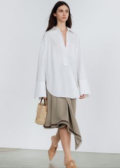 Color: Pure White Midweight cotton fabric Oversized fit Pointed collar Front patch pocket Wide cuffs Front button closure Unlined 100% Cotton Machine Wash Cold By Malene Birger. Imported Cotton Tunic Tops, Summer 2025, Frankie Shop, Top Design Fashion, Spring Summer 2024, Malene Birger, By Malene Birger, Women Shirt, Tunic Styles