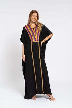 *Note : The kaftan in the video is a different color and is only displayed to show the fit, flow, and cut of the Kaftan. You will receive the one in the pictures.* A luxurious caftan with gold embroidery made of light mesh of linen and cotton, the fabric is unique in that it's very flowy and not the usual feel and touch of linen. This Kaftan is ideal to wear for any casual occasion. Whether taking a trip down the shopping lane, or home-based kitty parties, or about anything else, wearing this dress will make you feel classy and comfortable. Fabric : 50% Linen, 50% Polyester. Please note that the fabric on this Kaftan has some weight to it and is meant to give off that crumbled look. It's extremely breathable and made specifically for the African summer of Egypt so you feel like you're wear Bohemian Black Thobe In Tunic Style, Bohemian Black Thobe Tunic, Black Bohemian Tunic Thobe, Traditional Black Kaftan For Vacation, Black Bohemian Style Thobe, Black Kaftan For Beach And Eid, Eid Beach Black Kaftan, Bohemian Black Maxi Length Thobe, Bohemian Black Kaftan For Eid