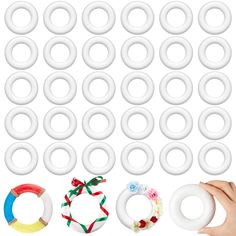 an assortment of different types of rings and bracelets with ribbons around them on a white background