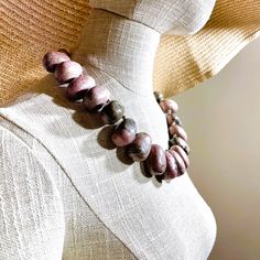 Rhodon, meaning Rose in Greek, is the name given to the stone when it was first discovered. Rhodonite is connected to the heart chakra, centering the self on sending love and compassion to the world.  This handcrafted necklace has large natural Rhodonite beads displaying the natural pink colors of the stone.  The necklace is a unique …   Read More » Bohemian Pink Agate Necklace, Adjustable Pink Agate Necklace, Pink Agate Gemstone Bead Necklace, Artisan Pink Jewelry With Round Beads, Artisan Pink Gemstone Beads Jewelry, Pink Agate Beaded Necklace With Round Beads, Pink Agate Beaded Necklaces With Round Beads, Spiritual Pink Beaded Necklaces With Natural Stones, Bohemian Pink Gemstone Bead Necklaces