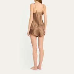 Simone Perele "Nocturnal" tank in silk charmeuse with a v-shaped cutout across chest. V neckline. Adjustable spaghetti-straps. Relaxed fit. Lace detailing at hem. Pullover style. Silk. Imported. Silk V-neck Camisole With Adjustable Straps, Silk Tank Top With Delicate Straps, Elegant Camisole With Tank Straps For Daywear, Silk Camisole With Built-in Bra And Spaghetti Straps, Sleeveless Silk Slip Dress With Built-in Bra, Silk V-neck Tank Top With Adjustable Straps, Silk Sleeveless Camisole For Daywear, Elegant Daywear Camisole With Straps, Silk Cami Slip Dress With Delicate Straps