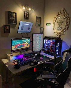 a computer desk with two monitors, keyboard and mouse