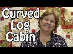 a woman standing in front of a quilt with the words curved log cabin on it