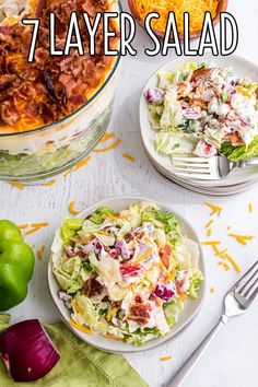 two plates with salad on them and the words 7 layer salad