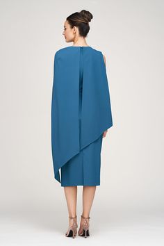 This woven stretch crepe sheath dress, falling just below the knee, features side body pleats and an asymmetric design. The angled fly-away back cape adds a dramatic touch to this elegant piece. Details Jewel Neck Sheath Silhouette Cape Sleeve Below Knee Length REF: 86112377 Pre-draped Midi Dress With Asymmetrical Hem And Draped Sleeves, Pre-draped Midi Dress With Asymmetrical Hem, Asymmetrical Hem Midi Dress With Draped Sleeves, Cocktail Midi Dress With Draped Cape Sleeves, Asymmetrical Dress With Draped Sleeves For Work, Black Tie Wedding Guests, Blue Florals, Cape Sleeves, Illusion Neckline