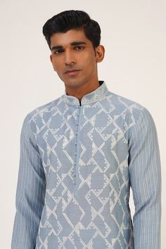 Mineral blue kurta with all over geometric pattern contrast thread and sequin embroidery. Paired with gathered churidar. - Aza Fashions Designer Kurta With Geometric Embroidery For Eid, Transitional Cotton Kurta With Geometric Embroidery, Unstitched Geometric Embroidery Kurta For Festivals, Designer Geometric Embroidery Kurta For Eid, Designer Eid Kurta With Geometric Embroidery, Festival Light Blue Kurta With Resham Embroidery, Festival Embroidered Semi-stitched Sherwani, Semi-stitched Blue Mulmul Kurta, Blue Resham Embroidery Semi-stitched Kurta