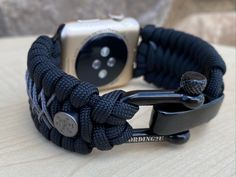 "FREE USPS PRIORITY MAIL SHIPPING FOR DOMESTIC US ORDERS (Includes U.S. Military APO/FPO Address Overseas) Thank you for visiting our shop \"Cording 2U\". A veteran owned business. Handcrafted Paracord wearables customized \"According To You\". Handcrafted with 100% Nylon Paracord \"MADE IN USA\" Our Products include: 🔹Custom handcrafted watch bands according to your wrist size, style, and color of choice. If you don't see it in our page yet, please contact us and we can discuss your options. ? Adjustable Black Watch Bands With Custom Hardware, Black Paracord Bracelet Strap Watch Band, Custom Black Watch Bands For Outdoor, Custom Black Outdoor Watch Bands, Adjustable Durable Black Apple Watch Band, Customizable Black Watch Accessories For Outdoor, Custom Black Watch Accessories For Outdoor, Adjustable Black Watch Bands For Customization, Black Watch Bands With Bracelet Strap For Customization