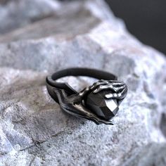 Unleash your inner psychic power with our mesmerizing Ring of Telekinesis. This handcrafted 925 sterling silver piece showcases an intricate design inspired by the mystical concept of telekinesis, featuring swirling patterns and delicate engravings. This unique, unisex ring is a must-have for any sci-fi or fantasy fan, or anyone who appreciates the allure of the unknown. The exquisite craftsmanship and polished finish make it a captivating accessory for any occasion. Available in various sizes f Spiritual Black Jewelry For Promise, Mystical Black Ring As Gift, Adjustable Mystical Sterling Silver Rings, Gothic Hand Cast Ring Jewelry, Black Symbolic Jewelry For Promise, Mystical Sterling Silver Rings As Gifts, Mystical Sterling Silver Rings For Gift, Gothic Sterling Silver Rings For Gift, Gothic Stainless Steel Ring As A Gift