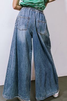 A washed denim pant featuring elasticized waist, contrasting front tie, side pockets and extra wide legDetails:Self : 100% CottonSize & Fit- Model is 5`8" And Wearing Size Small- Measurements Taken From Size Small- Approx. Length: 41" Baggy Wide Leg Cargo Jeans In Faded Color, Baggy Wide-leg Denim Bottoms, Faded Baggy Wide Leg Cargo Jeans, Baggy Faded Wide Leg Cargo Jeans, Faded Baggy Wide-leg Cargo Jeans, Baggy Denim Wide-leg Pants, Baggy Wide-leg Denim Pants, Baggy Full-length Jeans With Elastic Waistband, Baggy Wide Leg Faded Pants