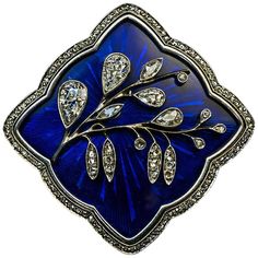 This exquisite Tsarist era brooch / pin was made in Moscow between 1908 and 1917 by a prominent jewelry firm of Feodor Lorie. The brooch is handcrafted in 14K gold and silver. It features a finely modeled Art Nouveau diamond flower mounted on a superb quality royal blue guilloche enamel plaque framed by rose cut diamonds. The flower is embellished with old pear cut, marquise cut and rose cut diamonds. Estimated total diamond weight is 1.20 ct. Marked with 56 zolotnik old Russian gold standard, M Bijoux Art Nouveau, Art Nouveau Antiques, Art Nouveau Jewelry, Enamel Brooch, Gold Brooches, Silver Brooch, Buy Gold, Gold Art, Best Diamond