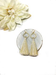 Looking for ways to stand out from the crowd? This gorgeous white statement dangle tassel earring will definitely grab everyones attention! With plenty of different styles to choose from, you will want to buy a set for every occasion (we definitely won't stop you!). This beautiful unique handmade earring is perfect for a beautiful spring / summer day out, a bridal shower gift, a birthday party, a bridesmaid gift or really any occasion you want to be unique! These trendy Tassel earrings are avail Trendy Gold Fringe Earrings, Trendy Gold Tassel Earrings With Fringe, Chic Metal Tassel Dangle Earrings, Chic Metal Dangle Tassel Earrings, Elegant Summer Dangle Hoop Earrings, Chic Silver Jewelry With Tassels, Chic Silver Tassel Earrings, Summer Fringe Chandelier Drop Earrings, Elegant Summer Chandelier Earrings With Tassels