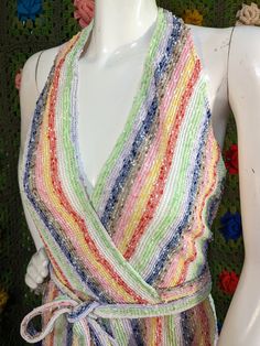 🌈 🌈 1970s schlubby knit halter jumpsuit in all the colors of the rainbow. Open back, halter clips at neck and has a wrap dress style tie at waist with metal zipper at back. Top is lined, but bottoms are unlined giving it a little peek-a-boo effect. Untagged, but very well constructed. Over all great vintage condition. Material does have some stretch throughout, but not at waist.  Model measurements: Bust 32 inches Pit to pit 12 inches Waist 26 inches Hips 33-34 inches Measured flat- P2P- 16 Waist- 13 Hips- 18 Rise- 15 Inseam- 27 Please take personal measurements to ensure fit. For further questions please send me a message. Fitted Multicolor V-neck Halter Top, Multicolor V-neck Halter Top For Spring, Spring Multicolor Halter Top For Party, Multicolor Spring Party Halter Top, Spring Party Multicolor Halter Top, Wrap Dress Styles, The Colors Of The Rainbow, Colors Of The Rainbow, Halter Jumpsuit