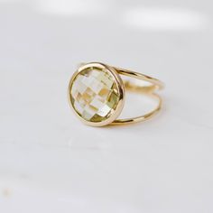 Lemon Quartz ring with double band in 14K solid gold. A modern and timeless stone ring with a natural quartz gemstone. A perfect gem gold ring for women, dainty and subtle that adds glam to every outfit. The best for her. 100% handcrafted with love! D E T A I L S ● Metal: 14K solid gold or 14K white gold or 14K rose gold ● Gemstone: Lemon Quartz, briolette cut ● Stone Diameter: 10mm (0.4in) or 12mm (0.5in) R I N G ∙ S I Z I N G For General Reference: ● we use standard US Ring Sizing ● an average Modern Gold Gemstone Birthstone Ring, Modern Gold Birthstone Ring With Gemstone, Modern Gold Crystal Ring With Gemstone, Modern Everyday Yellow Gold Crystal Ring, Modern Gold Rings With Round Stone, Modern Gold Ring With Round Stone, Modern Yellow Gold Crystal Ring For Everyday Use, Elegant Gold Rings With Green Amethyst, Elegant Yellow Gold Green Amethyst Rings