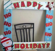 a happy holiday frame with a chair and snowman on it