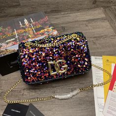 SHOP MORE LUXURY PRODUCTS HERE Description Dolce & Gabbana Multi-Colored Sequined 3.5 Shoulder Bag Muticolour For Women 10.6in/27cm DG BB7127AY0918B015 Size: 16 x 27 x 4 cm / 6.3 x 10.6 x 1.6 inches (Length x Width x Height) Front flap with hidden magnetic fasteningLight gold-plated sliding chainNappa lining with zipped pocket and flat pocketItem comes with a branded dust bag Includes dust bag.This product is of the premium quality. Dolce And Gabbana Handbags, Louis Vuitton Favorite, Louis Vuitton Shirt, Chanel Shirt, Ysl Shoes, Louis Vuitton Keepall, Loafer Mules, Prada Shoes, Belts For Women