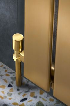 an open door with a gold handle on it