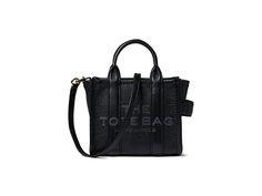 Marc Jacobs The Leather Crossbody Tote Bag - Handbags : Black : Opt for the stylish yet practical Marc Jacobs The Leather Crossbody Tote Bag for carrying your everyday essentials. Leather construction. Zippered closure. One spacious interior compartment. Engraved brand detailing on the front. Adjustable shoulder strap. Polyester lining. Dual top handles. Imported. Measurements: Bottom Width: 7 1 2 in Depth: 4 1 3 in Height: 5 9 10 in Strap Length: 25 3 16 in Handle Length: 3 1 7 in Handbags Black, Crossbody Tote Bag, Crossbody Tote, Everyday Essentials, Black Handbags, Product Reviews, Leather Crossbody, Marc Jacobs, Everyday Essentials Products