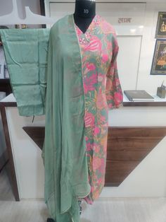 Embrace vibrant style with this stunning Kurti, Pant and Dupatta Set. The set comes with Muslin Kurti, Silk Pant and Chiffon Dupatta. The kurti looks simply gorgeous and the comfortable pants and flowy dupatta complete the look, making it perfect for any ocassion. Kurta Outfit, Tulip Pants, Silk Pant, Vibrant Style, Kurtis With Pants, Comfortable Pants, Dupatta Set, Chiffon Dupatta, Silk Pants