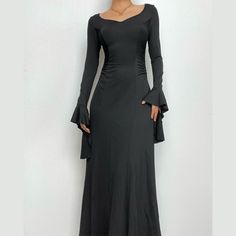 Please refer to our sizing chart for a guideline when choosing a size. 5 business days order processing time. 90% polyester 10% spandex. Ruched V-neck Maxi Dress, Elegant Ruched Maxi V-neck Dress, Elegant Long Maxi Dress In Solid Color, Elegant Long Solid Color Dress, V-neck Stretch Maxi Dress With Ruched Details, V-neck Ruched Stretch Maxi Dress, Chic Fitted Maxi Dress With Bell Sleeves, Elegant Fitted V-neck Dress In Solid Color, Stretch V-neck Solid Color Maxi Dress