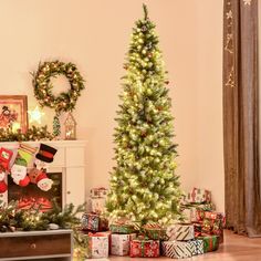 a christmas tree with presents around it