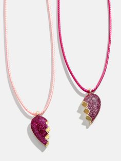 Show some love to your little one and their bestie with the Kids' Heart BFF Necklace Set. Each of these two necklaces feature a glittery split heart that when combined, fit perfectly together. So cute and perfectly pink, your mini me and their bestie won't ever want to take it off. Please note: intended for children 3+. Pink Heart Charm Necklace For Party, Pink Heart-shaped Charm Necklace For Party, Pink Personalized Charm Necklaces For Parties, Personalized Pink Charm Necklaces For Party, Cute Pink Heart Necklace For Mother's Day, Pink Heart Charm Necklace For Mother's Day, Pink Personalized Double Heart Necklace, Cute Pink Necklace For Best Friend, Personalized Pink Double Heart Necklace