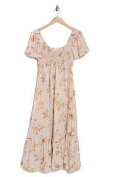 A garden of flowers bloom upon a midi dress fashioned with a sweetheart neckline and short sleeves. 50" length Slips on over head Sweetheart neck Short sleeves Lined 100% polyester Hand wash, dry flat Imported Spring Casual Midi Dress With Sweetheart Neckline, Casual Midi Dress With Sweetheart Neckline And Floral Print, Casual Midi Dress With Sweetheart Neckline For Spring, Ruched Short Sleeve Smocked Dress For Garden Party, Short Sleeve Ruched Smocked Dress For Garden Party, Casual Midi Dress With Sweetheart Neckline, Casual Smocked Dress With Ditsy Floral Print Short Sleeve, Casual Smocked Dress With Ditsy Floral Print, Bohemian Smocked Short Sleeve Dress With Floral Print