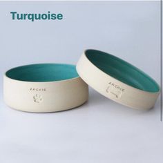 two bowls sitting next to each other on top of a white tablecloth with the words turquiose above them