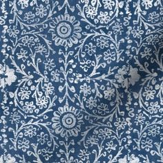 a blue and white floral pattern on fabric