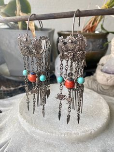 Chinese Imperial Court Ornate Silver Natural Red Coral Turquoise Tribal Hoop Chandelier Antique Earrings Lovley birds, flowers, and butterflyMotif Hoop style with drop dangle chains . Measures 4 1/2 in long . x 1 1/4 in wide Hoop Chandelier, Chandelier Antique, Usa Jewelry, Handcrafted Necklace, Antique Earrings, Coral Turquoise, Rock Crystal, Red Coral, Natural Red