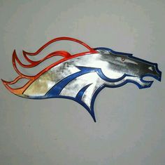 a metal horse head with red, white and blue flames on it's side