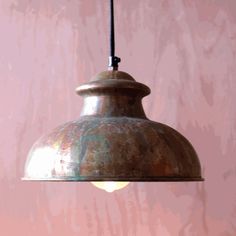 a metal light hanging from a wooden ceiling