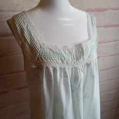 Vintage Light Blue Nightgown With darker blue and white flowers, and lovely lace  Sleeveless for super cool sleep Tag Label~ Pinehurst Tag Size~Medium Material~ 65%Polyester, 35% Cotton Find a garment you love, lay it flat and measure it, then compare! All measurements taken lying flat Shoulder to shoulder~15 inches Armpit to Armpit-20 inches Length~ 38 inches Hips- approx 24 inches There is some pilling and last photo shows a spot, this is hard material, perhaps glue??  Nightgown has been laund Lace Sleeveless Sleepwear For Pajama Party, Sleeveless Lace Sleepwear, Sleeveless Lace Nightgown For Pajama Party, Sleeveless Lace Sleepwear With Floral Print, Blue Sleeveless Lace Sleepwear, Lace Sleepwear With Floral Print, Floral Lace Sleepwear, Blue Lace Sleeveless Sleepwear, Vintage Camisole Sleepwear For Loungewear