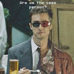 a man wearing sunglasses and holding a beer in front of his face with the caption are we the same person?