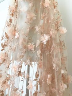 an image of a sheer curtain with flowers on it